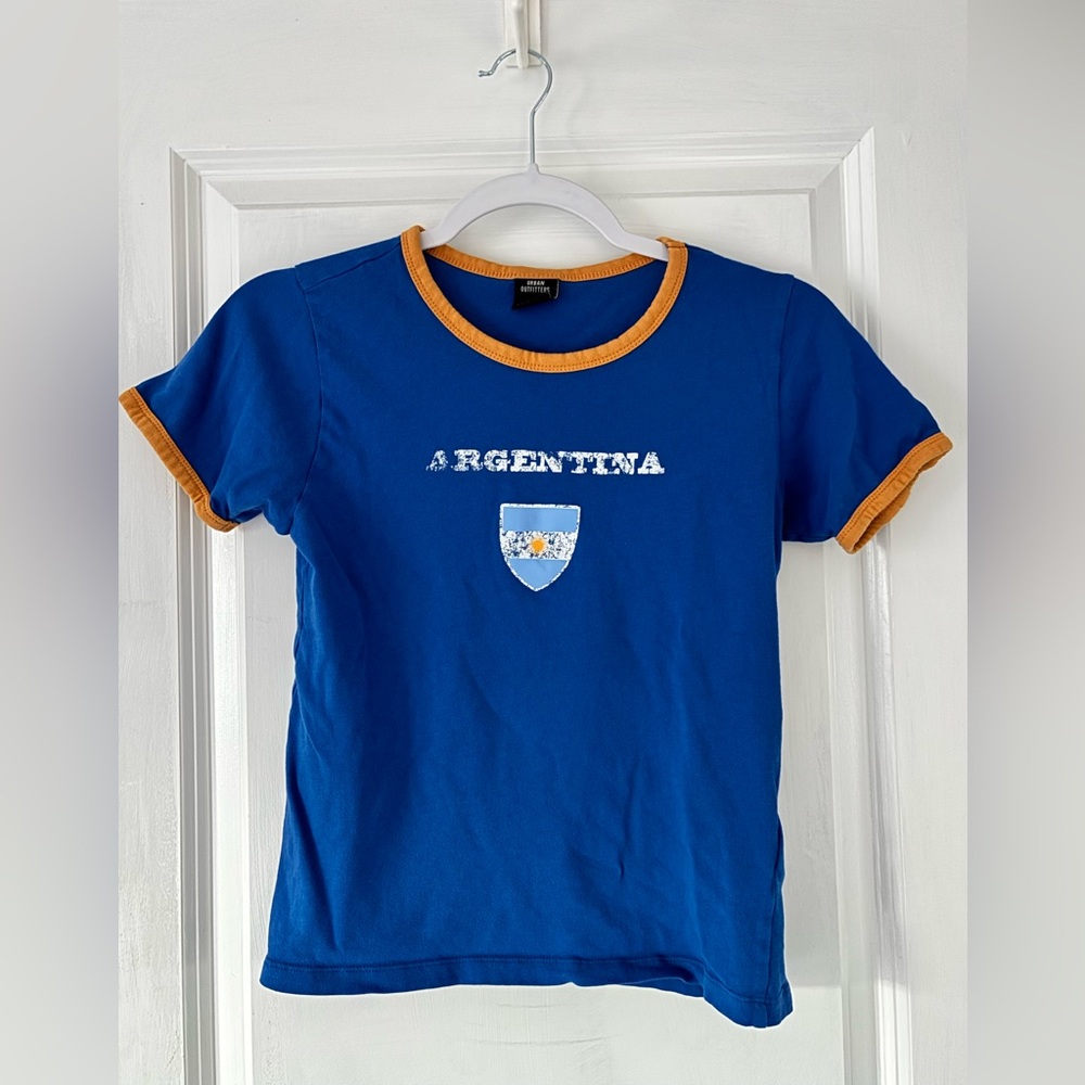 Urban Outfitters Blue “Argentina” baby tee